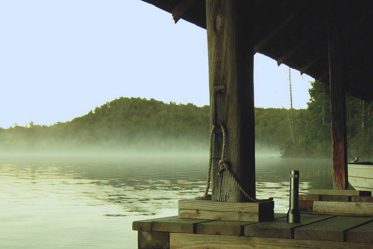 Individual carefully reviewing life insurance policy documents to understand coverage details